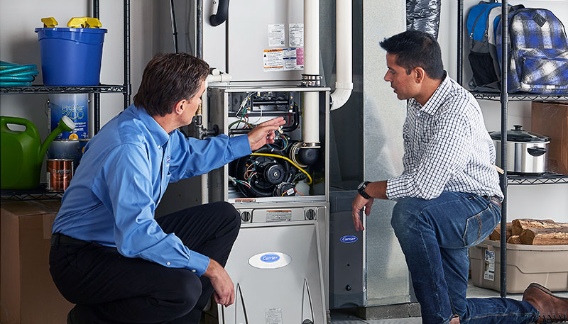 HVAC technician evaluating a furnace for repair or replacement in Eagle Mountain