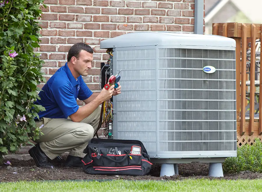 HVAC technician inspecting an outdoor air conditioning unit in Eagle Mountain