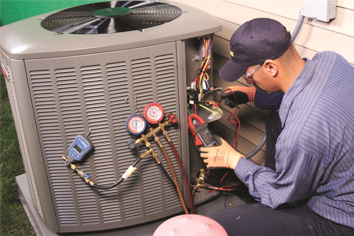 HVAC technician testing an outdoor air conditioning unit in Eagle Mountain